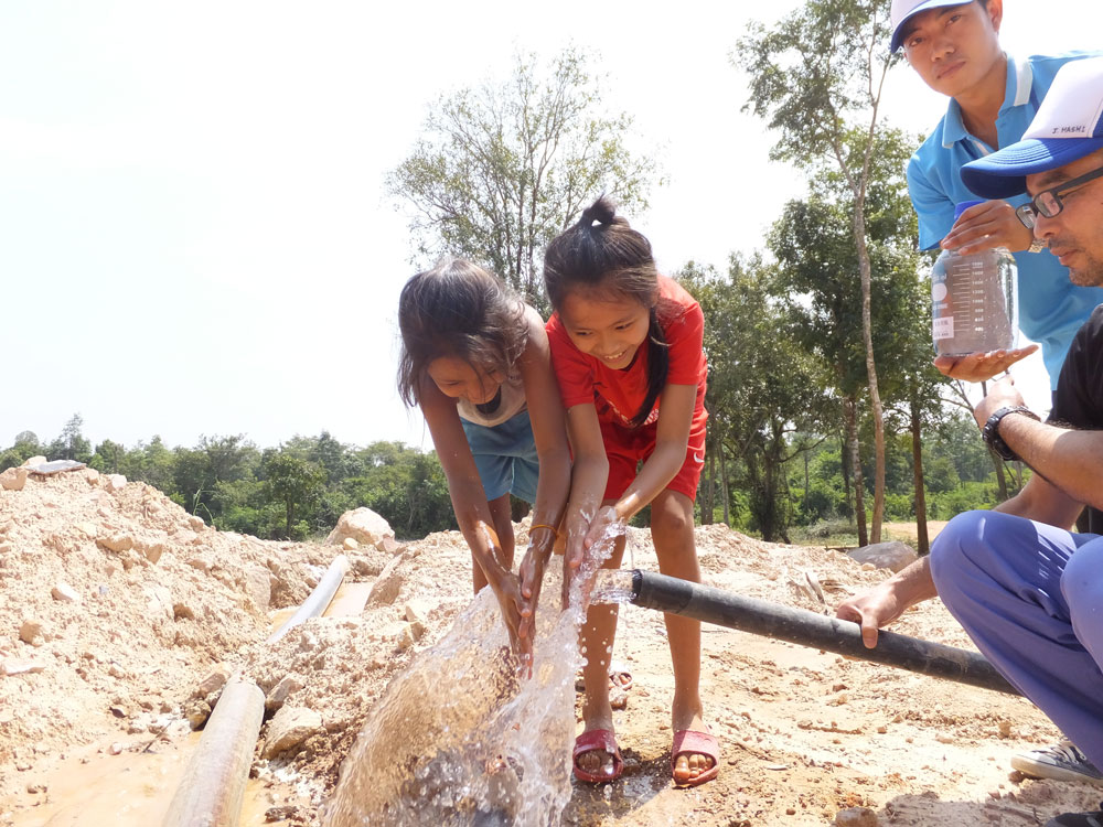 Local children gathered during the trial run of the system